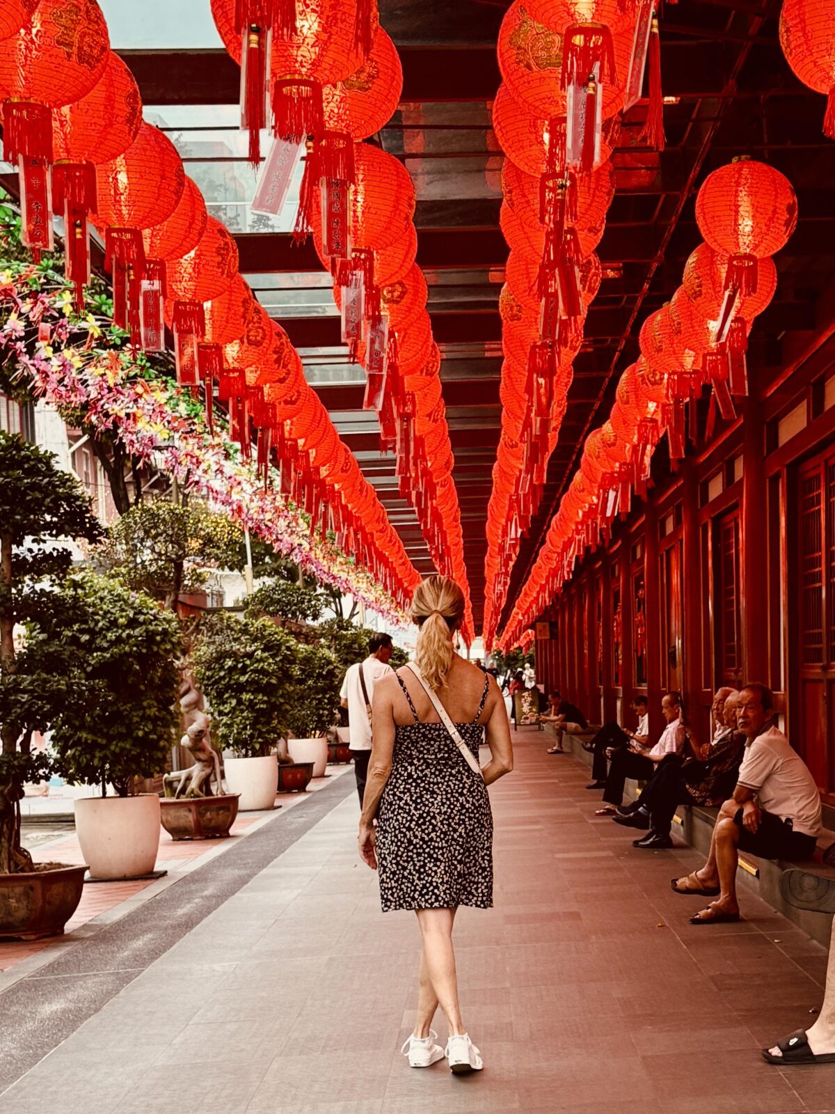 At the Buddha Tooth Relic Temple Girl in Singapore under lanterns