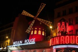48 Hours in Paris: The Perfect 2-Day Itinerary for First-Timers 39 Brightly illuminated Moulin Rouge windmill in Paris at night.