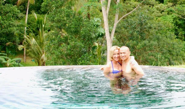 Photo of Jennifer and her husband at the pool of villa semana