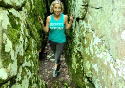 Jen standing in a crevice between rocks