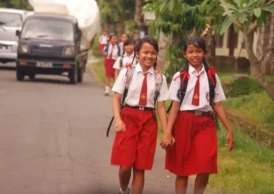 Photo of two schoolgirls walking, Denpasar, Bali