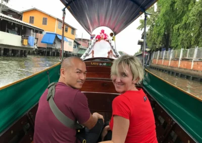 Photo of Jennifer and her husband in a boat in Bangkok, Thailand