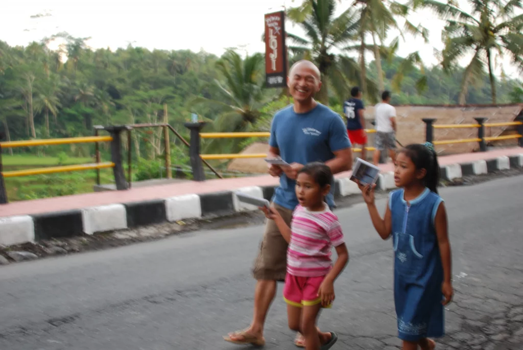 Photo of Jennifer's husband walking along with little girls