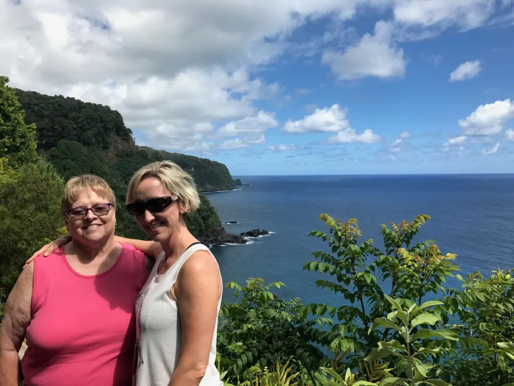 Photo of Jennifer and her mother at a cliff at Hawaii