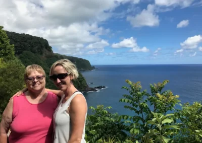 Photo of Jennifer and her mother on a cliff in Hawaii