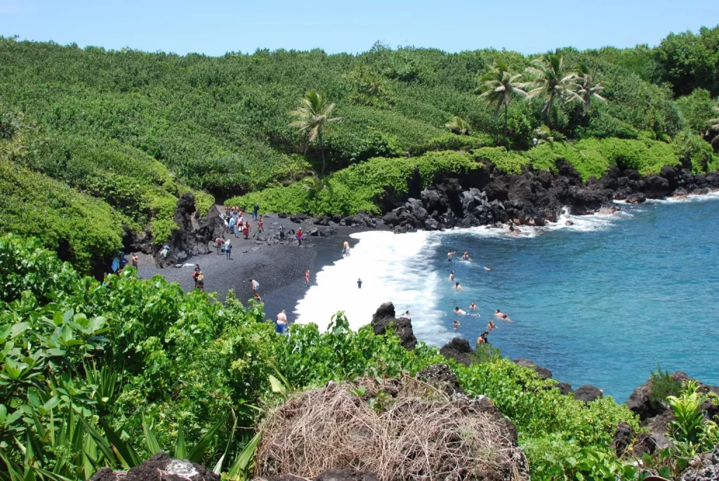 Photo of a beach at hawaii with black sand