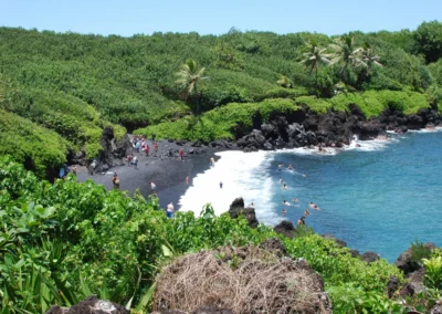 Photo of a beach in hawaii with black sand