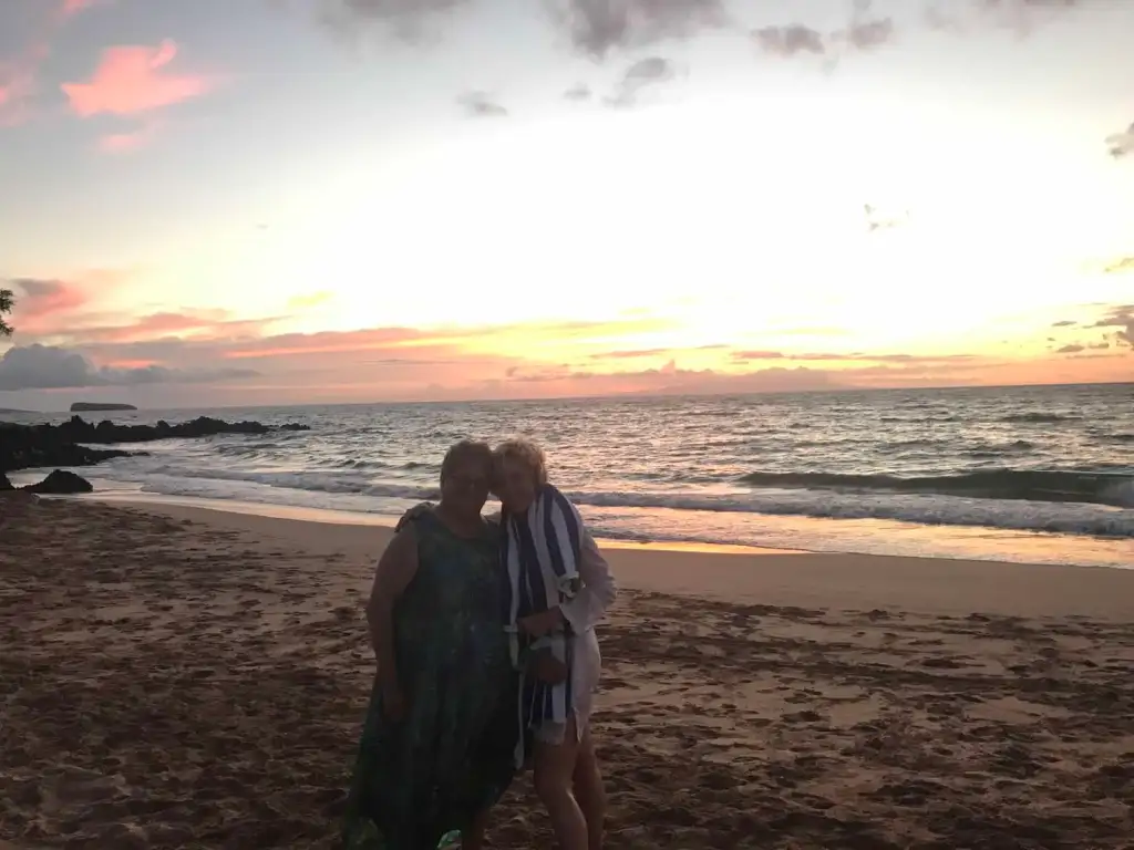 Photo of Jennifer and her mother at the beach at sun down
