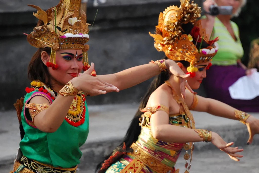 Photo of two woman dancing at a festival
