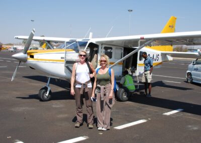 two women and two men by plane