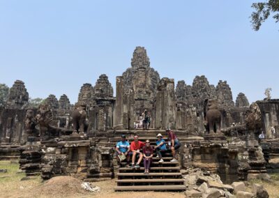 Friends on steps of ancient temple