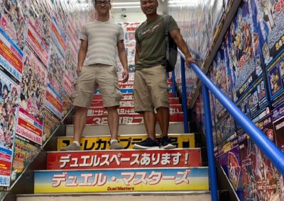 men in comic book store on stairs