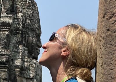 Woman rubbing noses with temple face