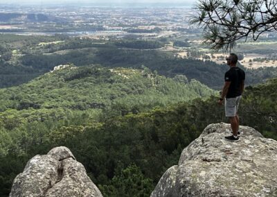 Man standing on rock surveying vast scenery