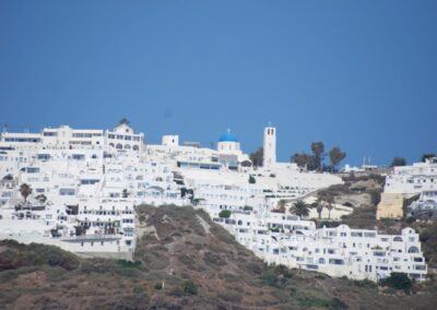 Whitewashed buildings on cliffside