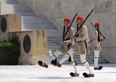 guards marching with pom moms on their shoes carrying rifles