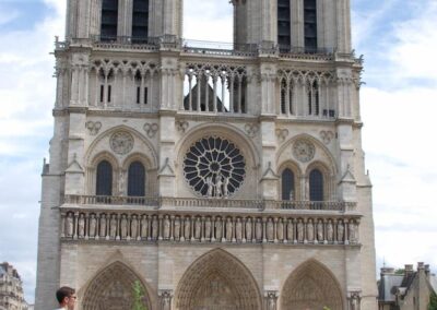 Cathedral of Notre Dame with lots of tourists and flowers