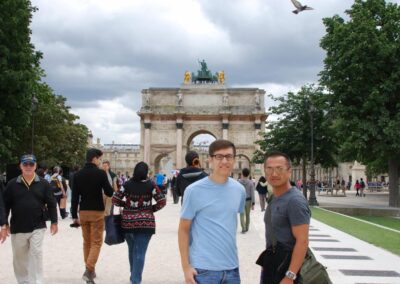 two men and tourists in Paris