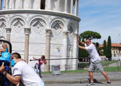 Forced perspective of man "pushing" leaning tower of Pisa