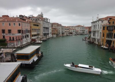 Canal with boats lined by buildings