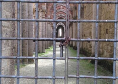 row of arches seen through locked gate